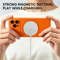 REDEFYNE charging pad held in hand with strong magnetic suction while charging