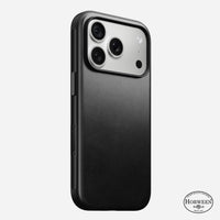 Nomad Modern Horween leather case in black on iPhone 18 Pro, rear view showing leather back and frame