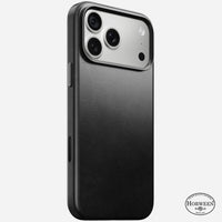 Nomad Traditional Horween leather case in black on iPhone 18 Pro Max, rear view showing full-wrap leather and camera ring