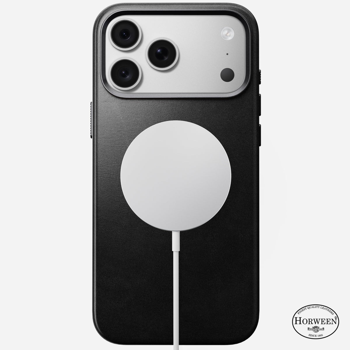 Angled view of the black Horween leather Nomad case on iPhone 18 Pro Max showing anodised aluminium side buttons