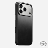 Nomad Traditional Horween leather case in black on iPhone 18 Pro, rear view showing full-wrap leather and camera ring