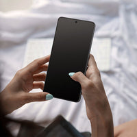 Galaxy S26 Ultra in hand with Spigen anti reflection glass protector applied for clearer viewing