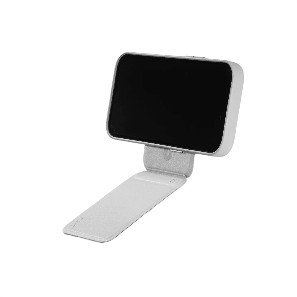 Portrait stand mode of the MOFT Snap tripod wallet on a desk