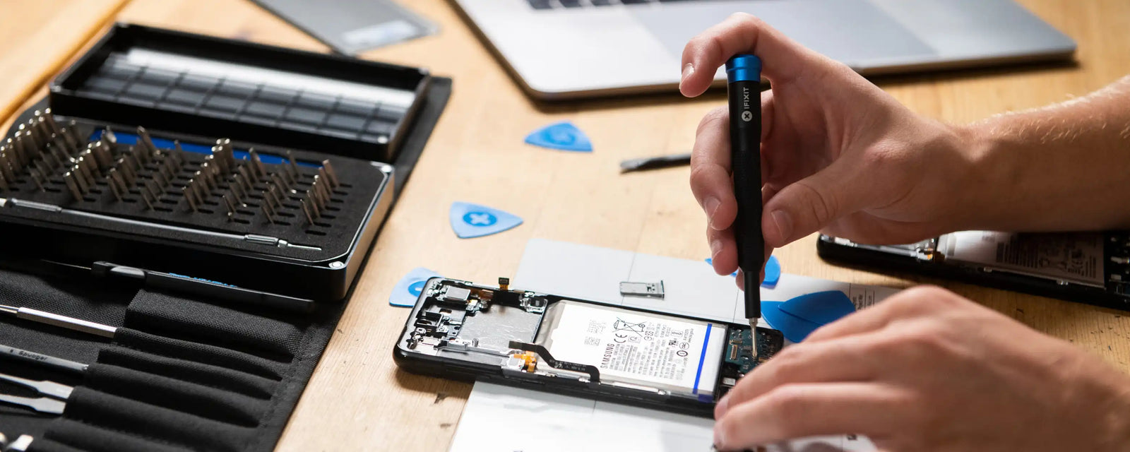 Technician repairing a mobile phone