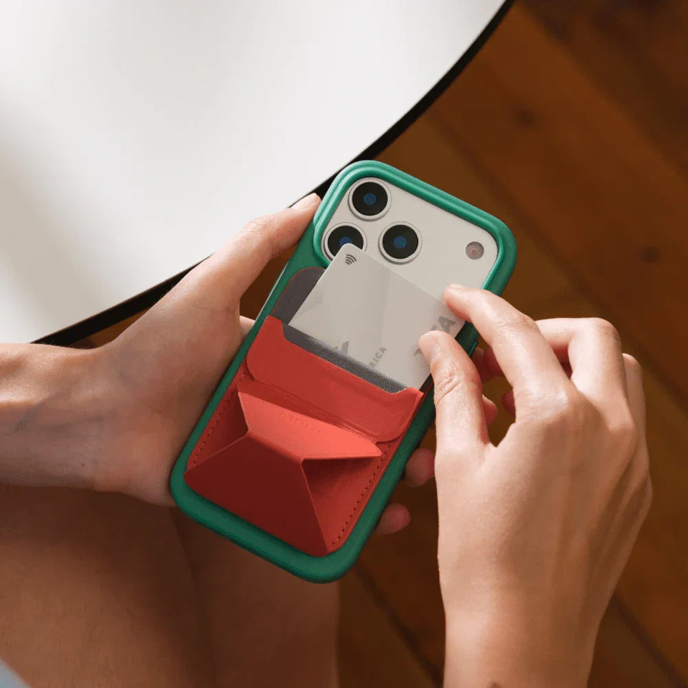 MOFT Snap-On wallet magnetically attached to the back of an iPhone
