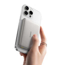 Hand holding a smartphone with a clear case, displaying the brand 'baseus'.