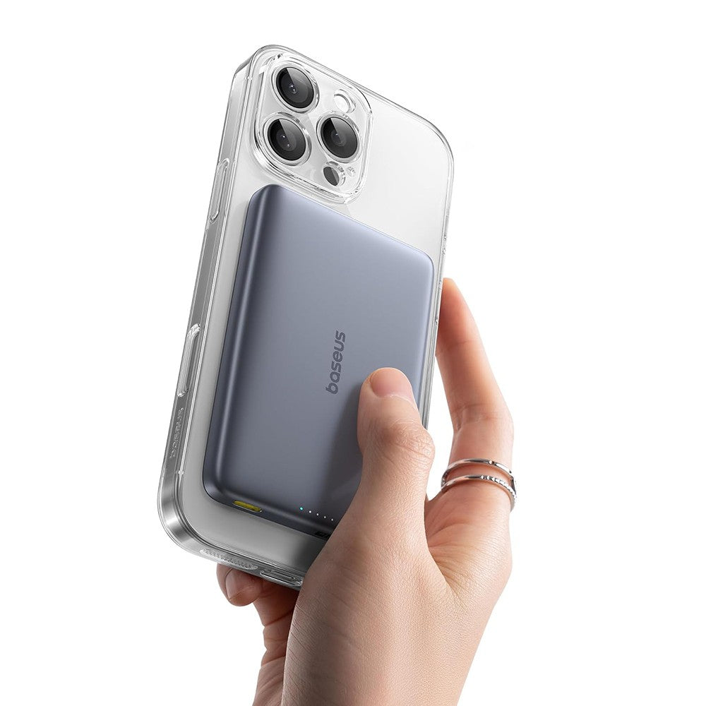 Hand holding a smartphone with a clear case on a white background