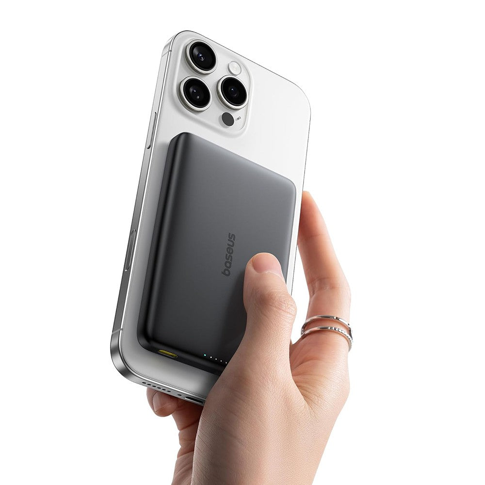 Slim magnetic power bank attached to a smartphone